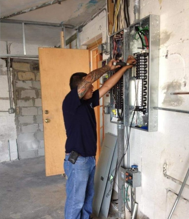electrician repairing an electrical panel in miami